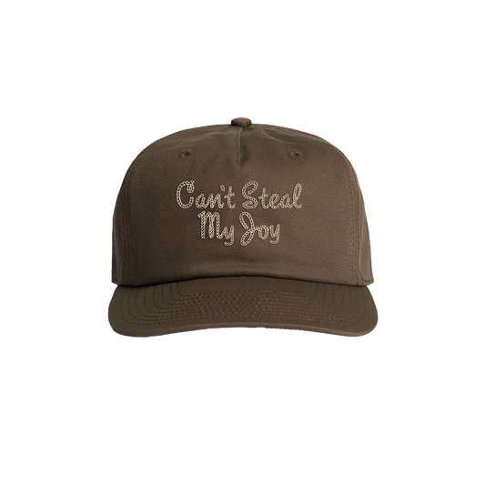 A brown baseball cap with the text 'Can't Steal My Joy' embroidered on the front.
