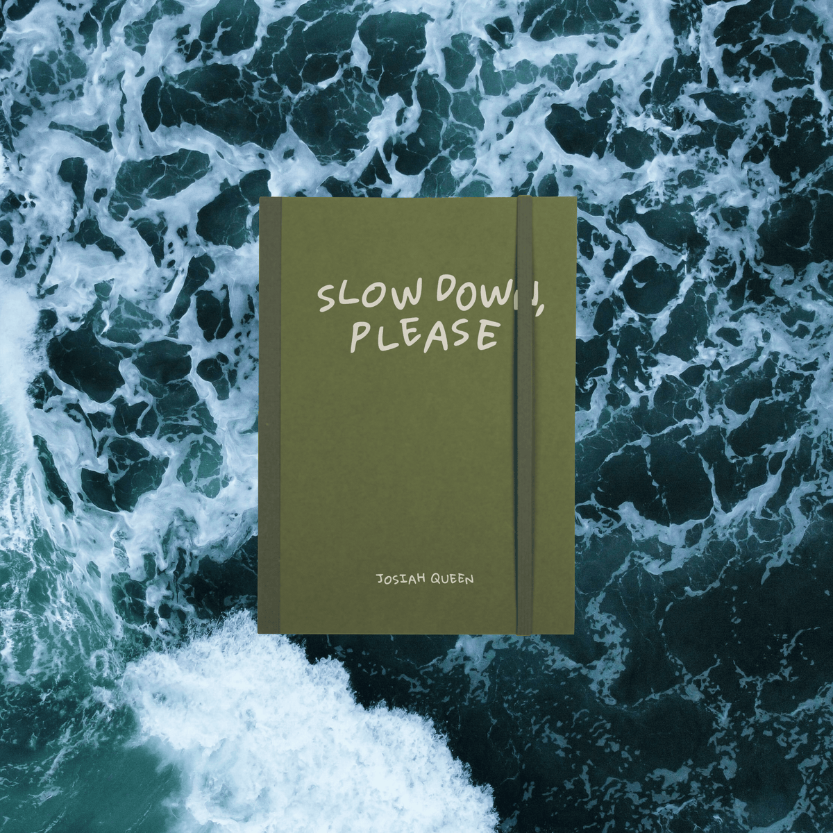 Green Notebook with 'Slow Down, Please' Josiah Queen text , elastic bungee page holder on a background of ocean waves